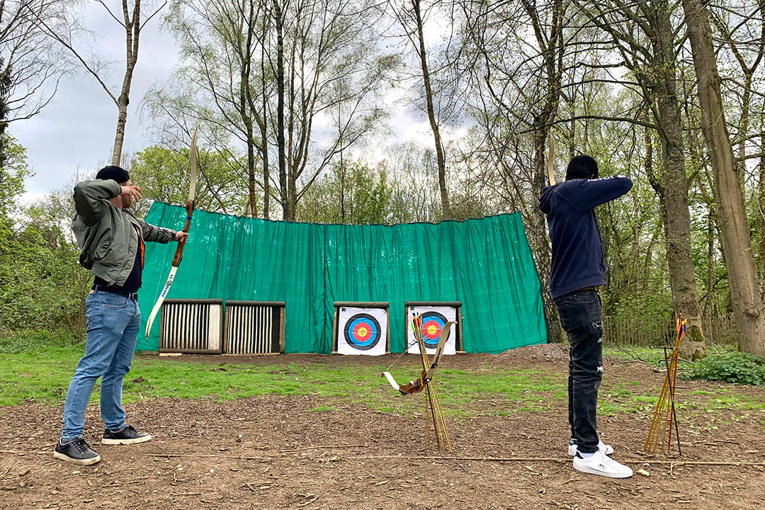 Picture of two young people trying archery at SOLD © Vicki Felgate/Big Leaf Foundation