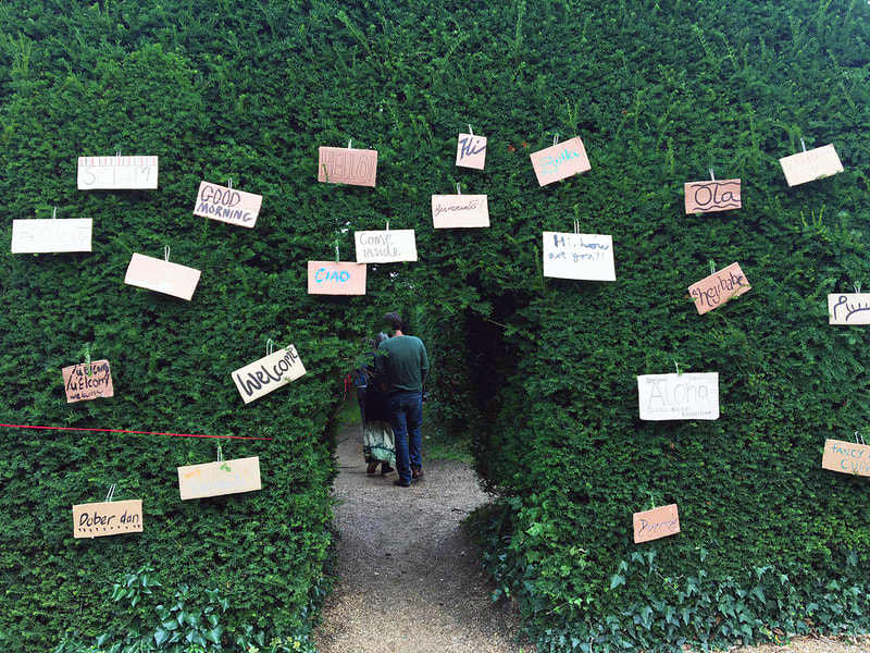 Picture words written on paper hanging from hedge at Guifa Project © Big Leaf Foundation