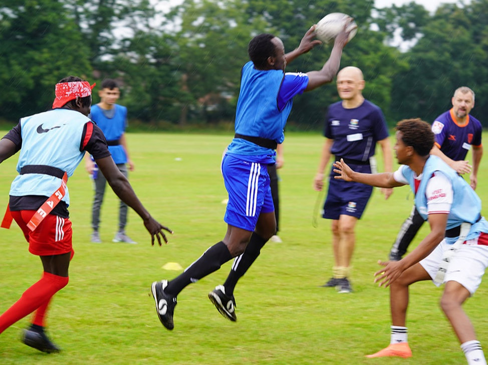 Picture of group of young people playing touch rugby together © Big Leaf Foundation