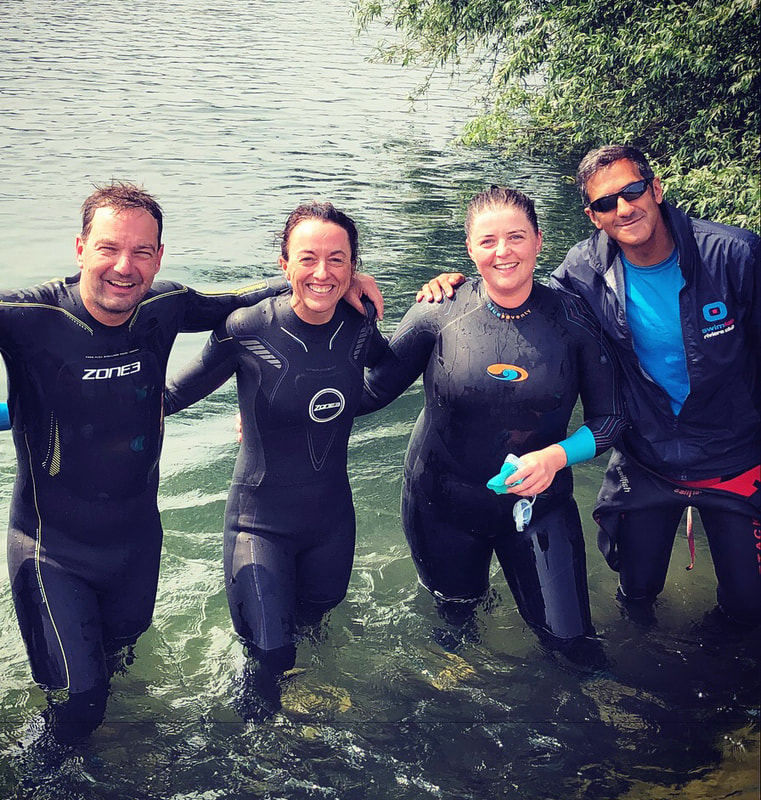 Picture of Salim (right) and some of his students after an open water swim session © SwimLab